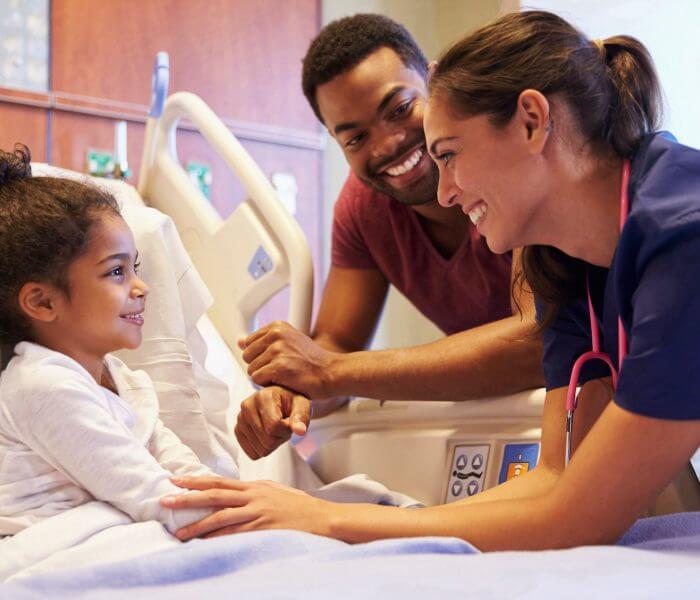 Child with father and nurse